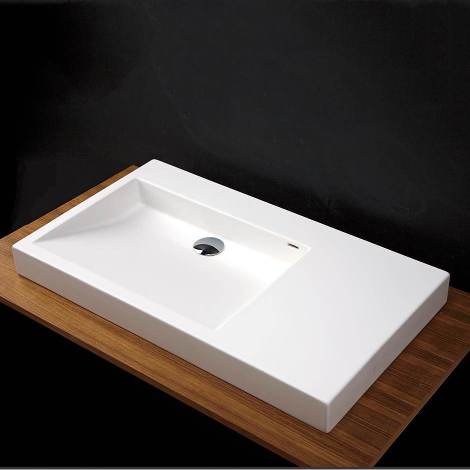 Fixtures, Etc.LacavaVanity top Bathroom Sink with shelf on the left, made of solid surface, with an overflow.